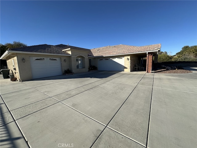 single story home with a garage