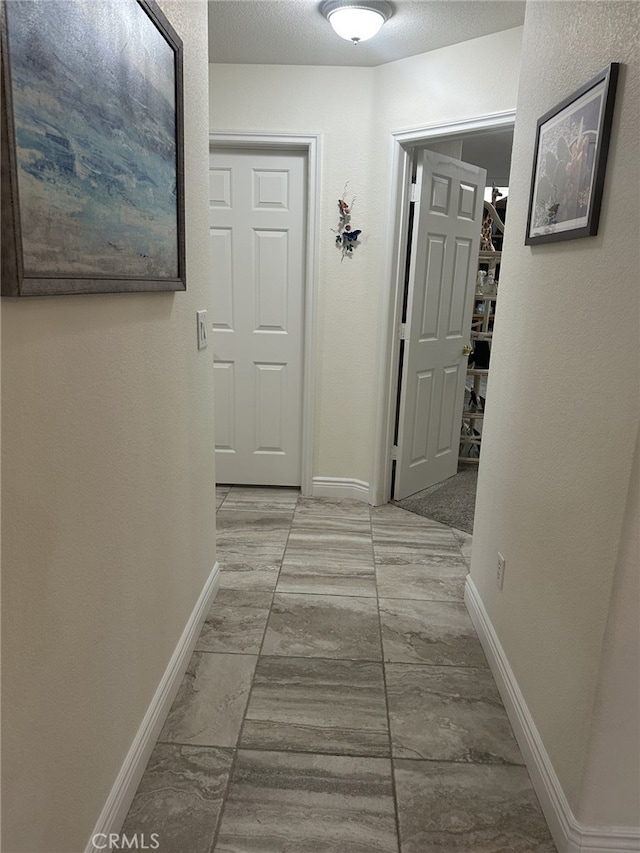 16232 Ridge View Dr, Apple Valley, CA 92307 - hall featuring baseboards and marble look tile flooring