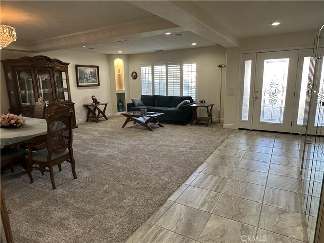 living room featuring light colored carpet and a wealth of natural light