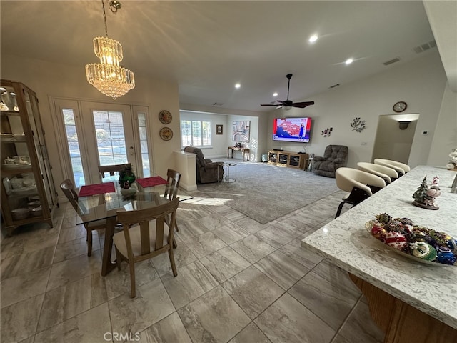 dining space with vaulted ceiling and ceiling fan