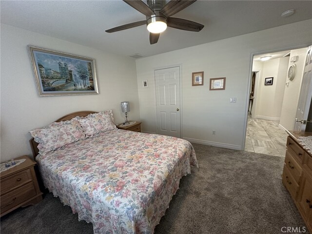 carpeted bedroom with ceiling fan