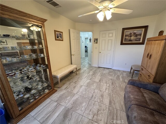 living room with ceiling fan