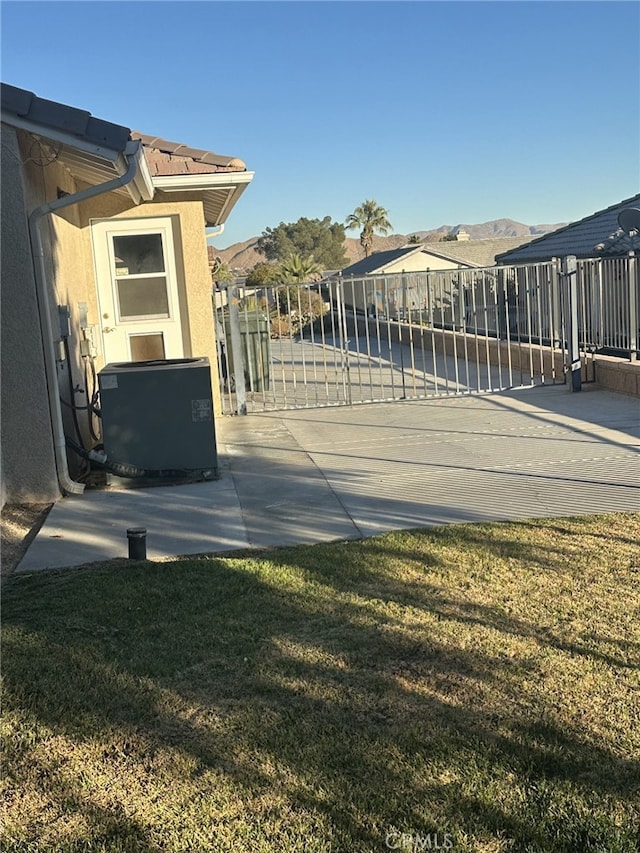 view of yard with a mountain view and cooling unit