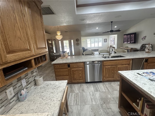 16232 Ridge View Dr, Apple Valley, CA 92307 - kitchen with stainless steel dishwasher, a sink, open floor plan, brown cabinets, and vaulted ceiling