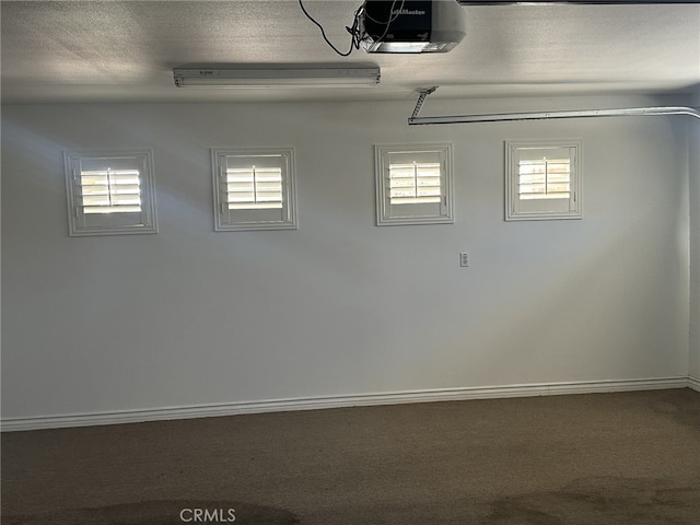 16232 Ridge View Dr, Apple Valley, CA 92307 - garage with a garage door opener and baseboards