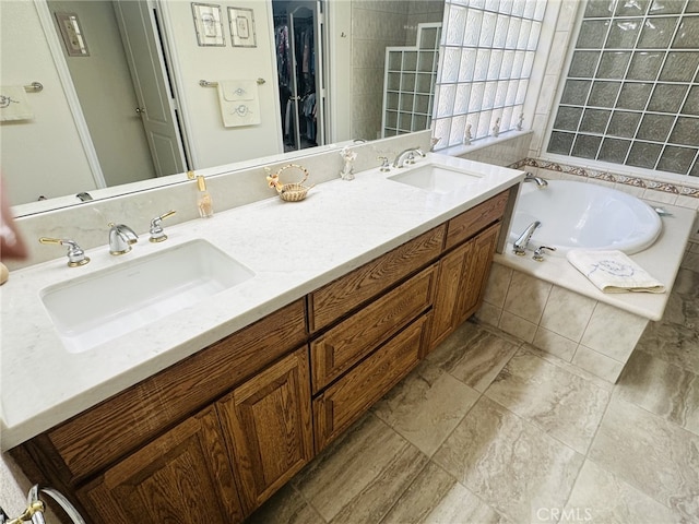 16232 Ridge View Dr, Apple Valley, CA 92307 - bathroom with a garden tub, a walk in closet, double vanity, and tiled shower