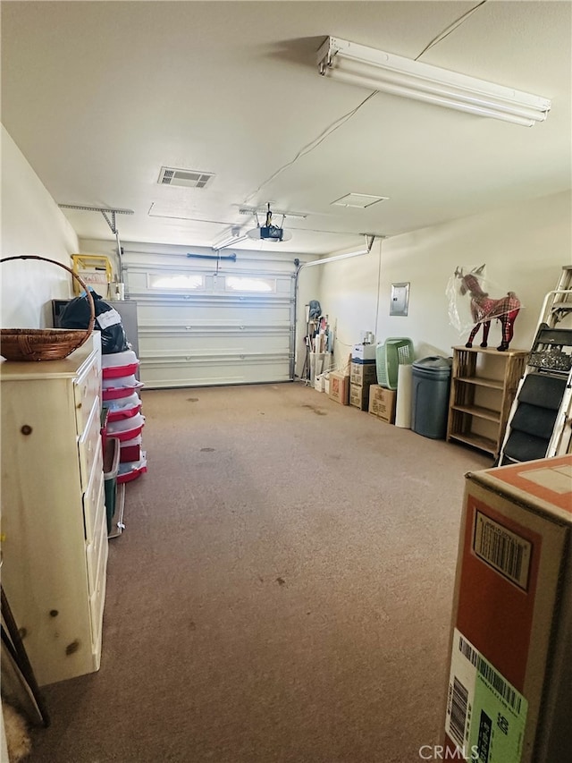 16232 Ridge View Dr, Apple Valley, CA 92307 - garage featuring a garage door opener and electric panel