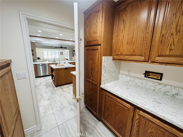 16232 Ridge View Dr, Apple Valley, CA 92307 - kitchen featuring dishwasher, light marble finish flooring, brown cabinets, a sink, and recessed lighting