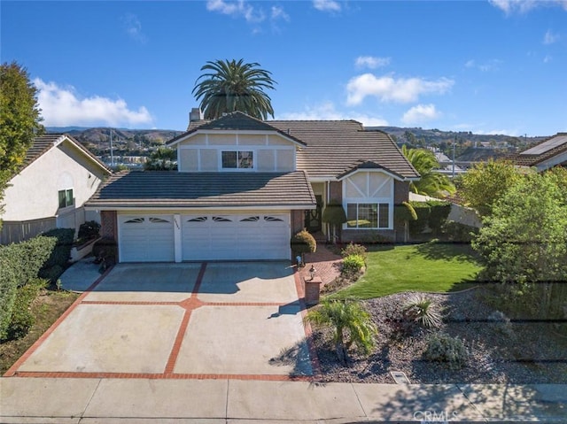 view of front of property with a front lawn and a mountain view