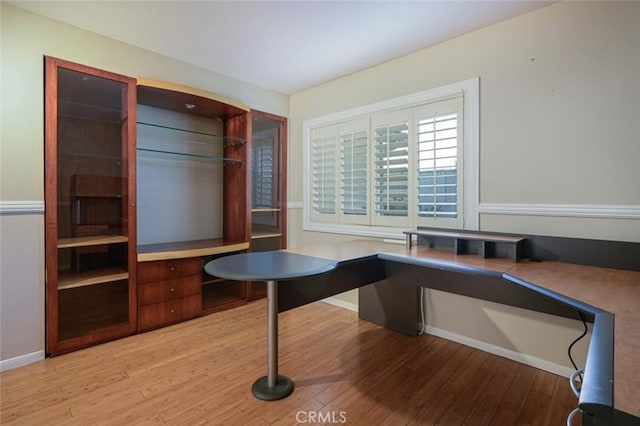 unfurnished office featuring light wood-type flooring