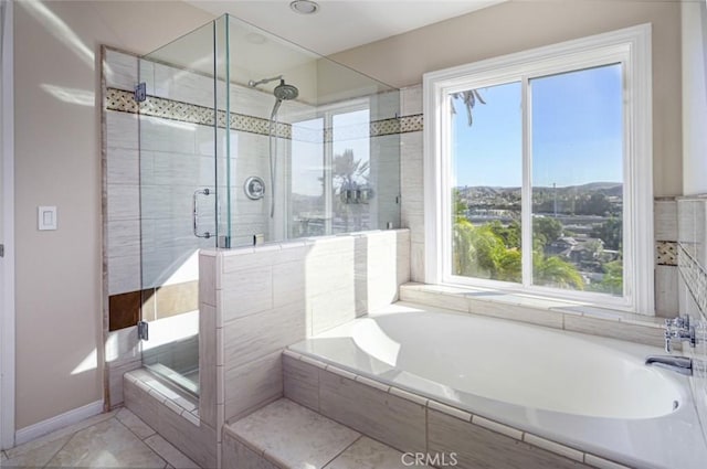 bathroom featuring independent shower and bath and tile patterned flooring