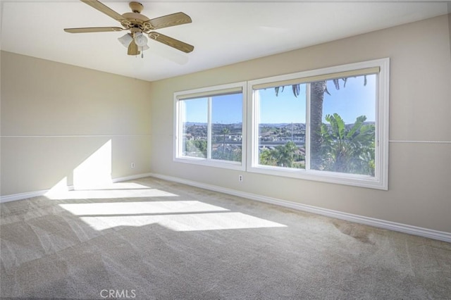 carpeted empty room with ceiling fan