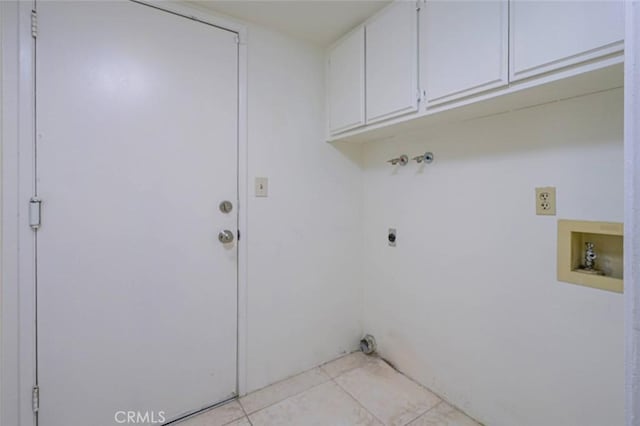 laundry area featuring cabinets, hookup for a washing machine, electric dryer hookup, and light tile patterned floors