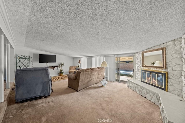 living room featuring carpet floors and a stone fireplace