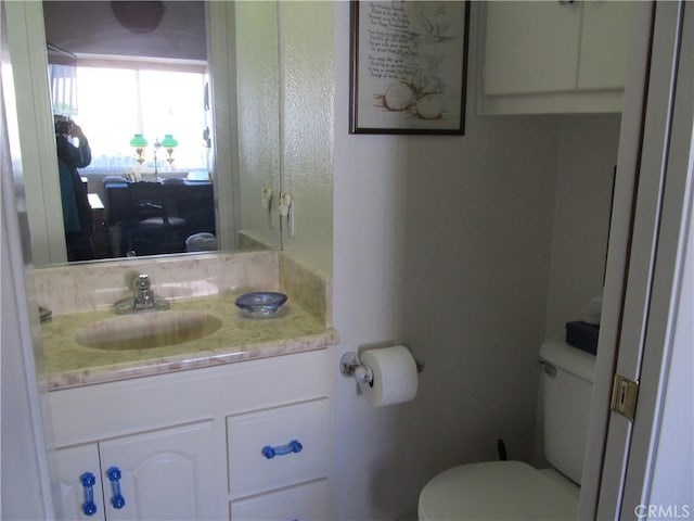 bathroom with vanity and toilet