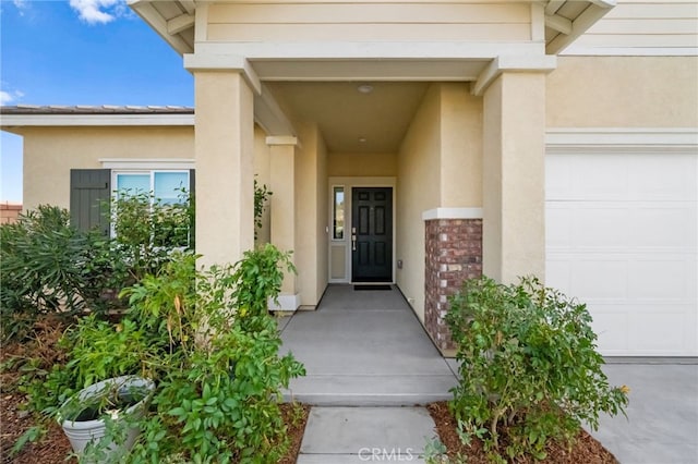 view of exterior entry featuring a garage