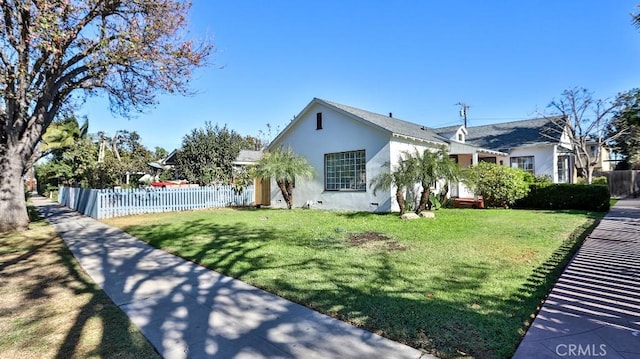 view of property exterior with a yard