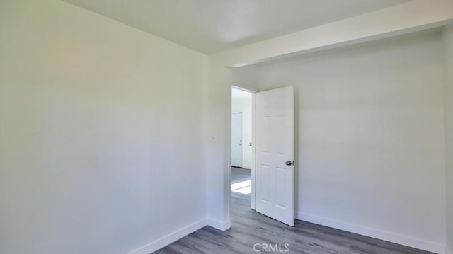 empty room with dark wood-type flooring