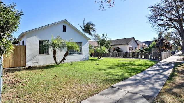 view of home's exterior featuring a lawn