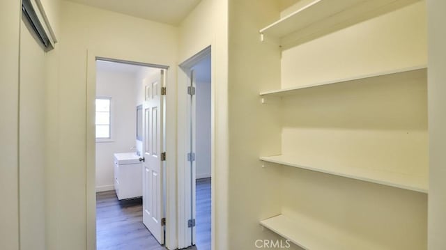 hall with hardwood / wood-style floors