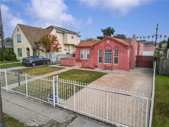 view of front of home with a front yard and a jacuzzi