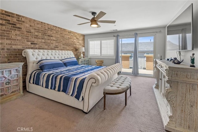 bedroom with ceiling fan, brick wall, light colored carpet, and access to outside