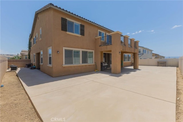 back of property featuring a patio