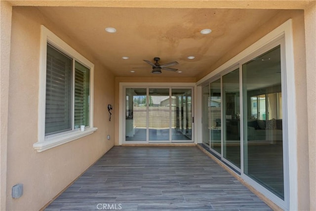 wooden deck with ceiling fan