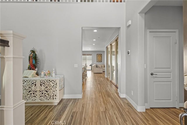 hallway with wood-type flooring