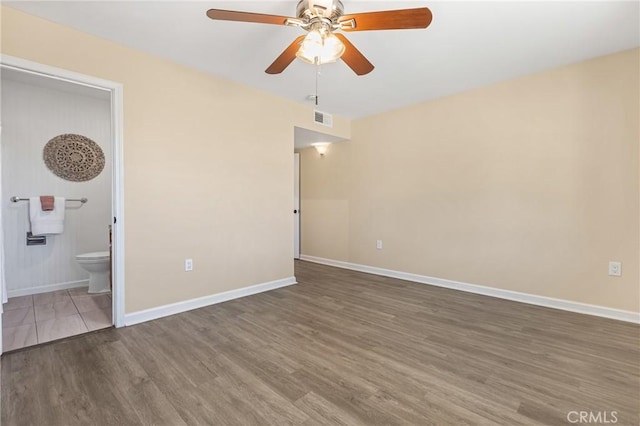 interior space featuring ceiling fan and dark wood-type flooring