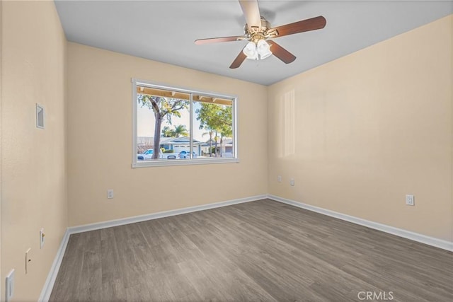 unfurnished room with ceiling fan and hardwood / wood-style floors