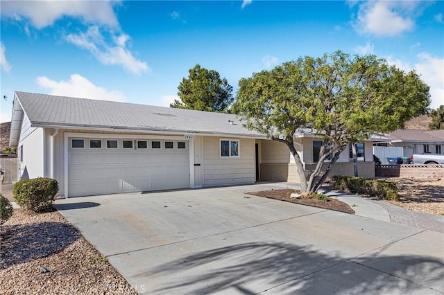 ranch-style house featuring a garage