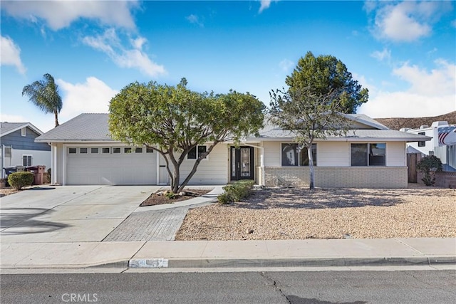 ranch-style home featuring a garage