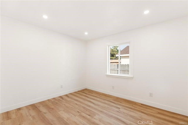 spare room with light hardwood / wood-style floors