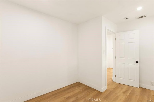 spare room with light wood-type flooring