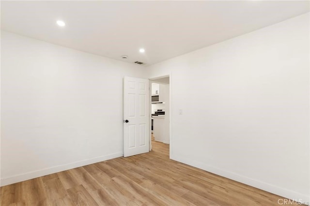 empty room featuring light hardwood / wood-style floors