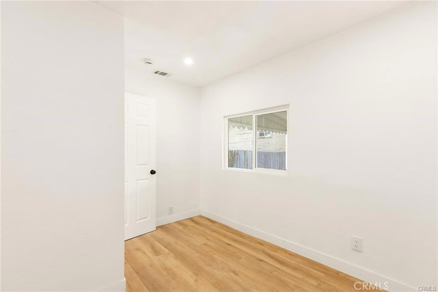 unfurnished room featuring light wood-type flooring