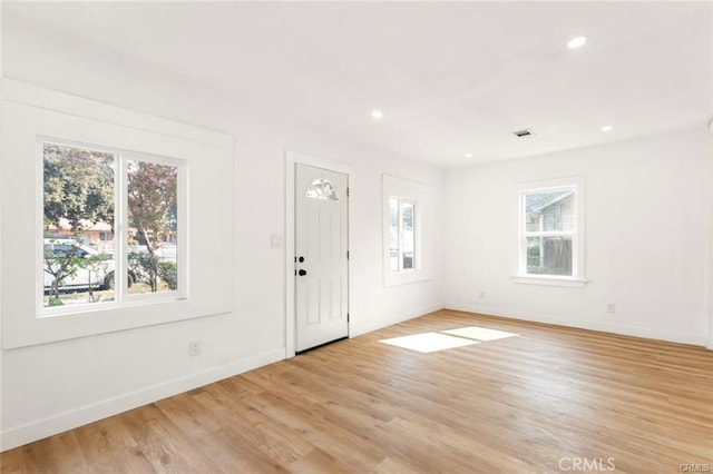 entryway with light hardwood / wood-style flooring