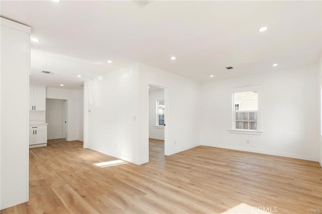 spare room featuring light hardwood / wood-style flooring