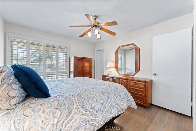 bedroom featuring ceiling fan and light hardwood / wood-style flooring