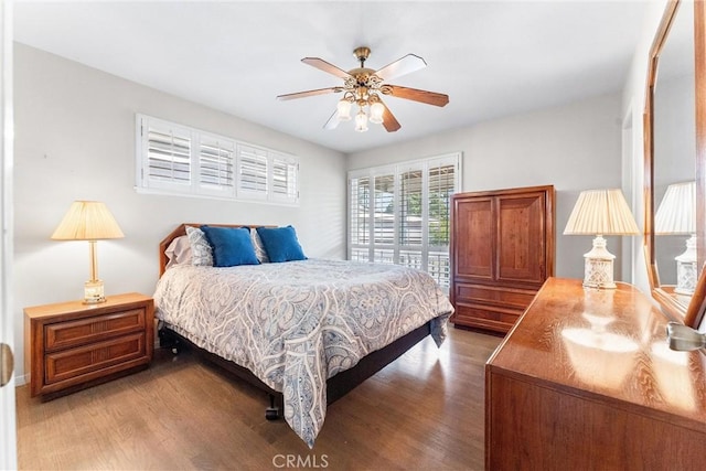 bedroom with hardwood / wood-style floors and ceiling fan