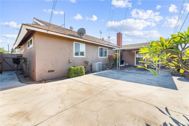 back of property featuring a patio and central AC unit