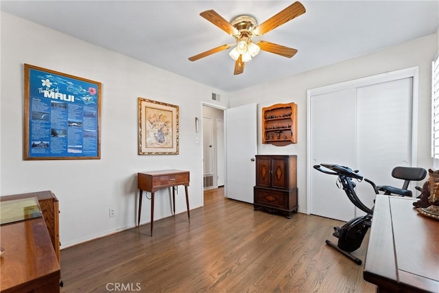 interior space with dark hardwood / wood-style floors and ceiling fan