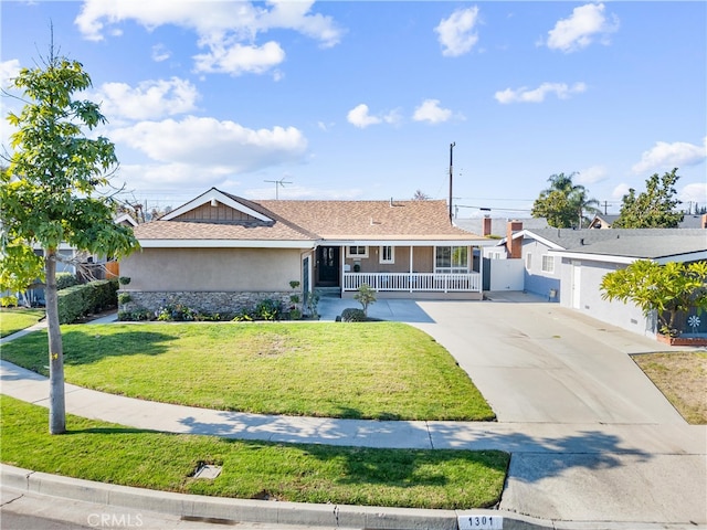 single story home with a front yard and a porch