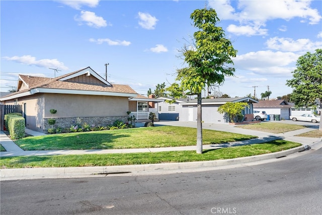 single story home with a garage and a front lawn