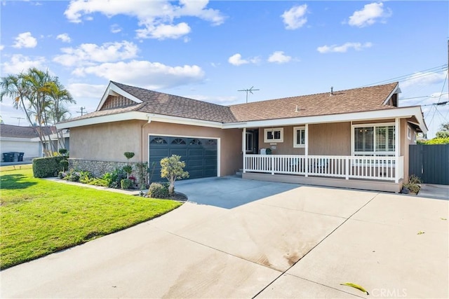 ranch-style house featuring a front yard, a porch, and a garage