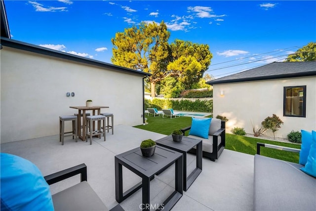 view of patio / terrace with a swimming pool and an outdoor hangout area