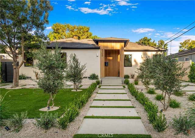 view of front of property with a front lawn