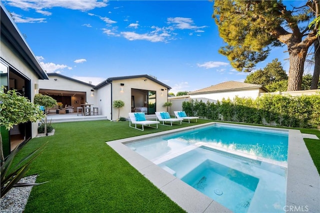 view of pool featuring an in ground hot tub, outdoor lounge area, a yard, and a patio