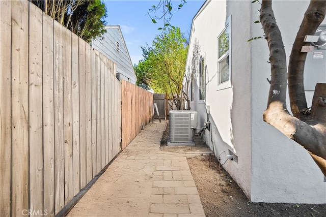 view of property exterior with central AC unit